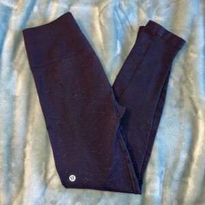 Purple and white Lululemon Free to Flow leggings